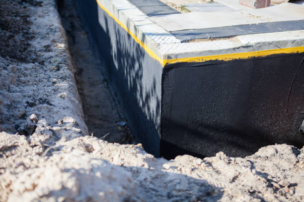 Professional Basement Waterproofing technician working in Echola, AL